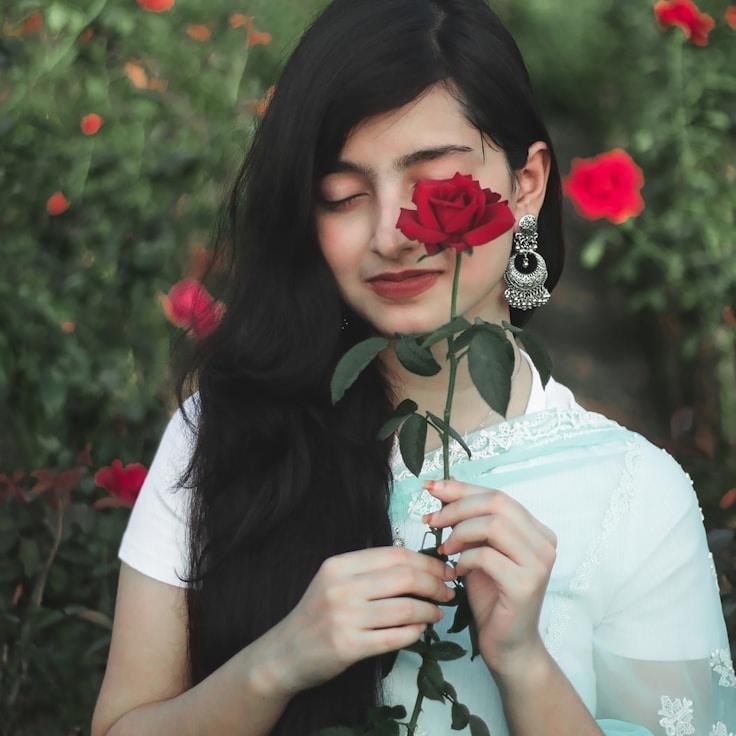 Kaveri Mehta, Lead Design Curator at Distant Harvest Circle, reviewing corporate floral arrangements